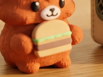 The printed hamburger held by the Mofflits Highland